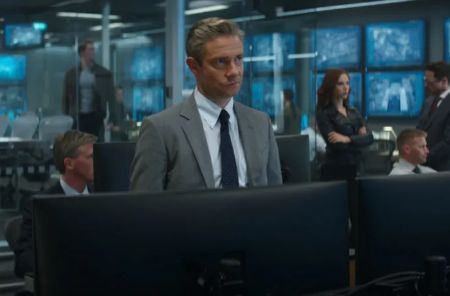 Everett Ross in a grey suit